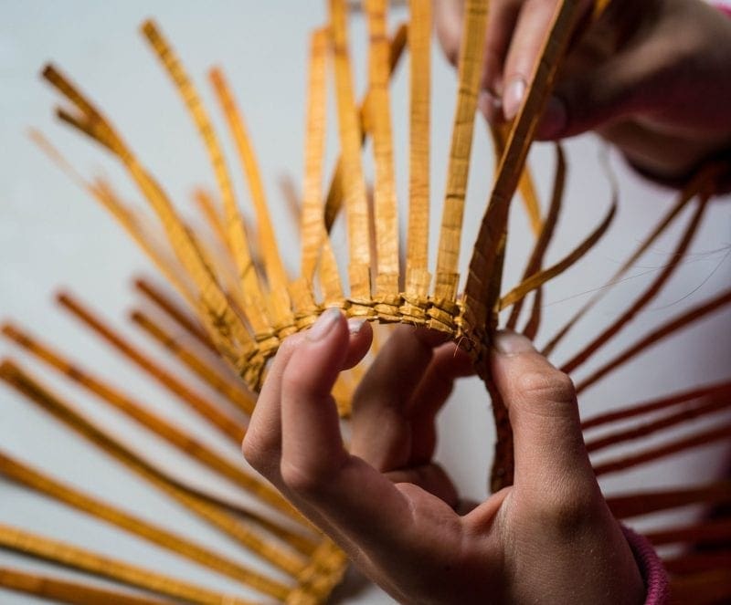 An image of traditional Alaska Native regalia being made